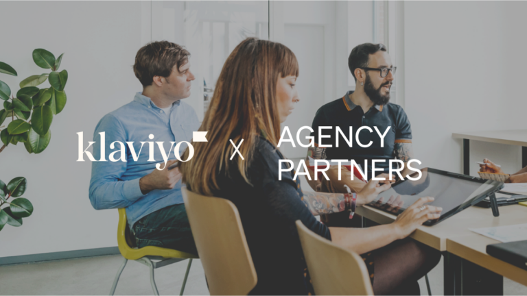 Klaviyo x Agency partners over 3 people sitting at a table talking